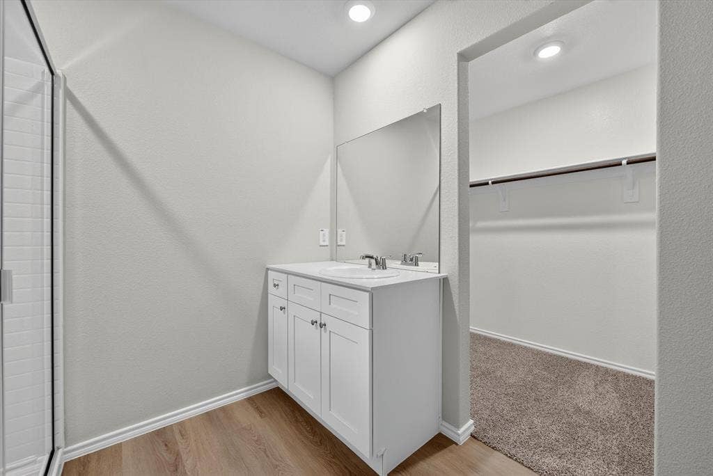 5413 Flannel Lane, Denton, TX 76249 White vanity with an integrated sink and chrome fixtures