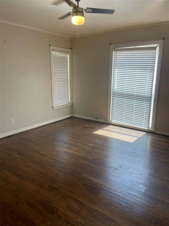 1527 Harbor Road, #1527, Dallas, TX 75216 Dark wood-finish flooring with light-toned walls, featuring a ceiling fan with integrated lighting and multiple windows