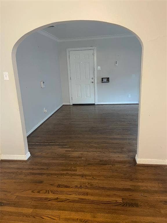 1527 Harbor Road, #1527, Dallas, TX 75216 Archway entry with wood-finish flooring, crown molding, and a paneled entry door