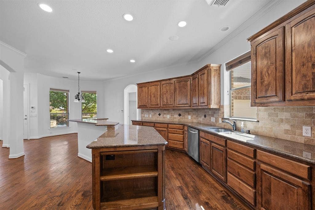 5960 Indigo Sky Drive, Frisco, TX 75036 The kitchen island is perfect for serving.