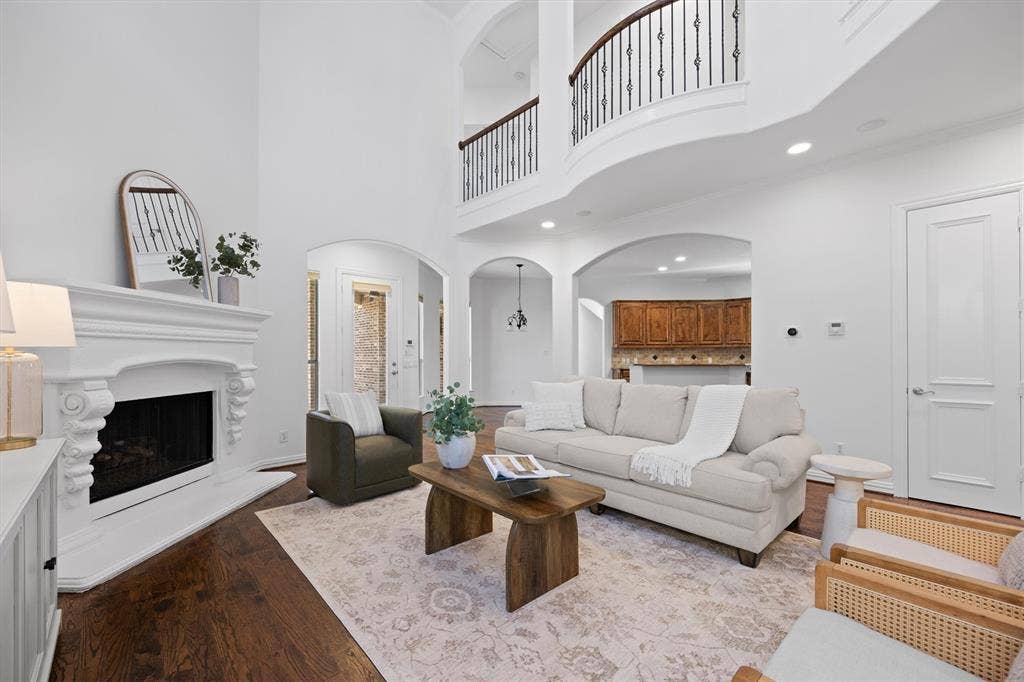 5960 Indigo Sky Drive, Frisco, TX 75036 Stone fireplace and beautiful hardwood floors.