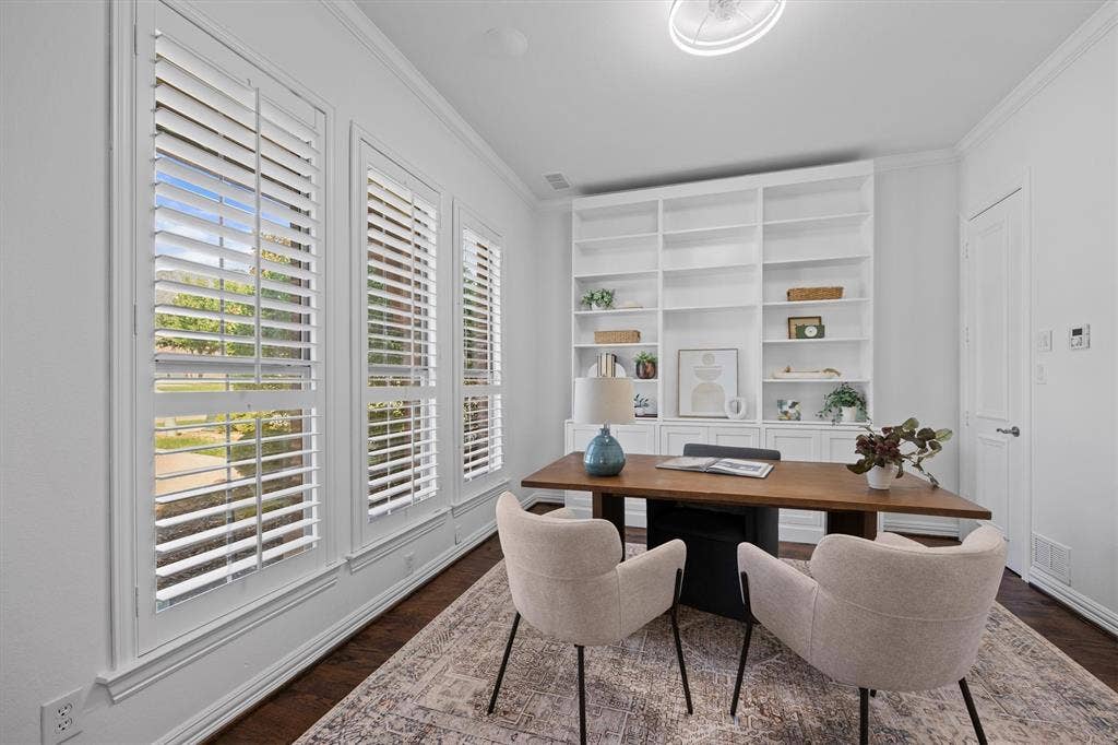 5960 Indigo Sky Drive, Frisco, TX 75036 Built in shelving and plantation shutters adorn the office.