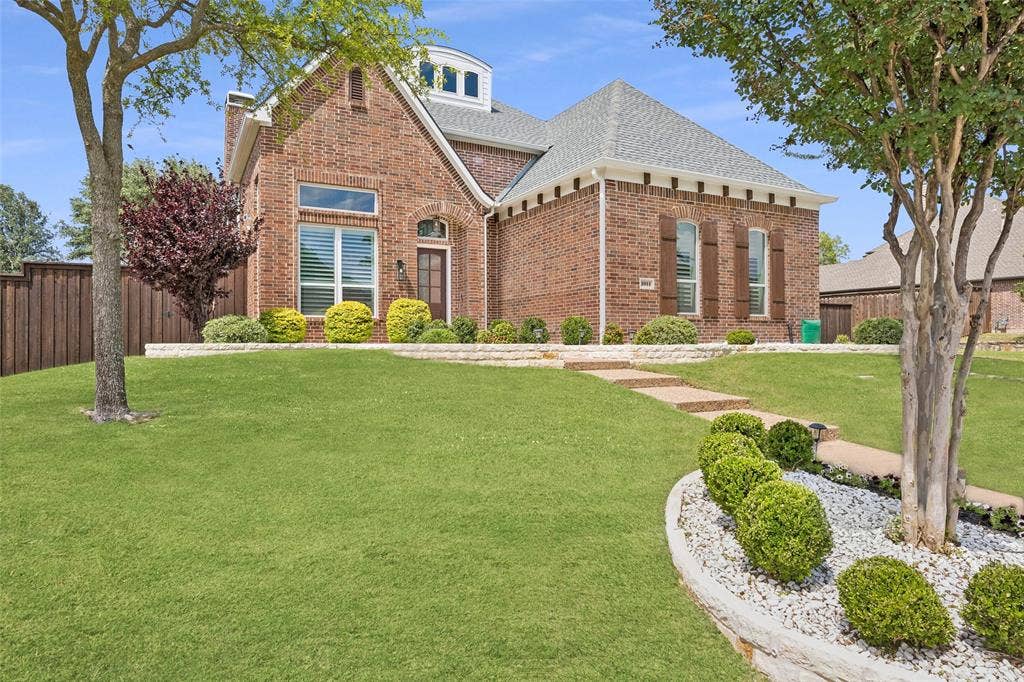 1011 Three Rivers Drive, Prosper, TX 75078 Timeless brick elevation with mature landscapingand inviting curb appeal.