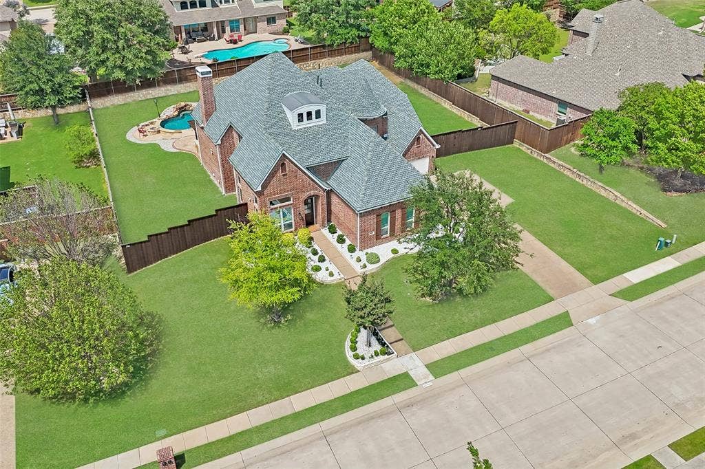1011 Three Rivers Drive, Prosper, TX 75078 Stunning aerial view showcasing the expansive lot,sparkling pool, and generous outdoor space.