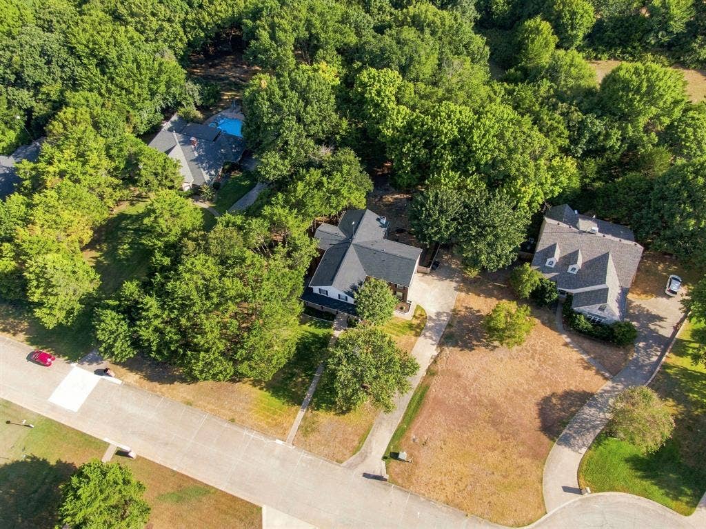 7030 Pecan Creek Circle, Midlothian, TX 76065 Bird's-eye view of the home tucked among beautiful towering trees