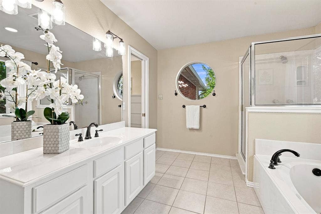 7030 Pecan Creek Circle, Midlothian, TX 76065 Spacious double vanity bathroom with crisp white cabinetry, polished countertops, and dual undermount sinks.