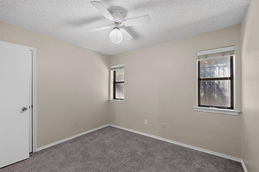 1606 Treehouse Lane, Plano, TX 75023 Neutral-toned walls complement plush carpeting