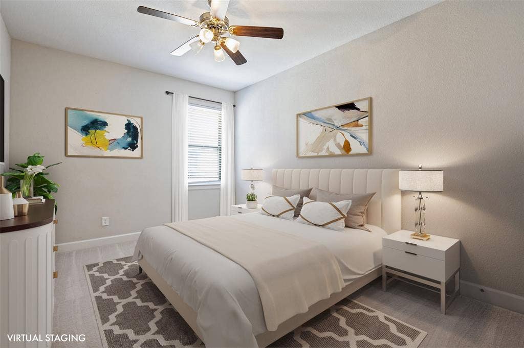 Comfortable secondary bedroom offers a welcoming space for family or guests with a walk-in closet for ample storage.