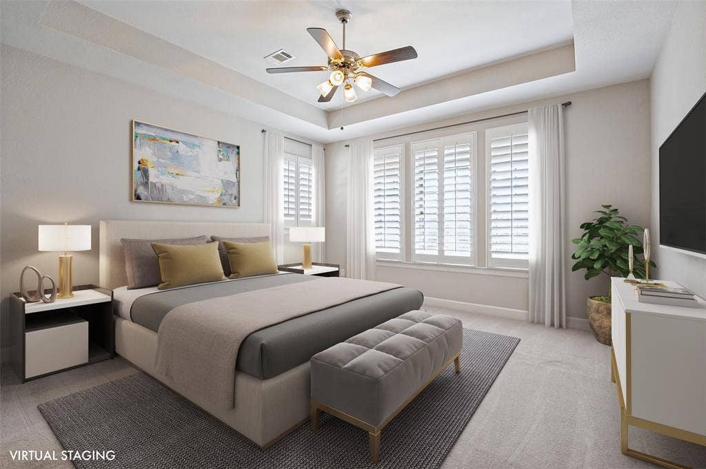 Spacious & serene, the primary suite offers a peaceful escape with a tray ceiling, beautiful natural light & plenty of room to truly unwind.