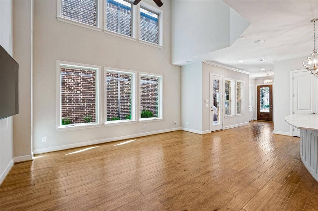 Soaring two-story ceilings create an airy, impressive living space with a bright, polished backdrop for your personal style.