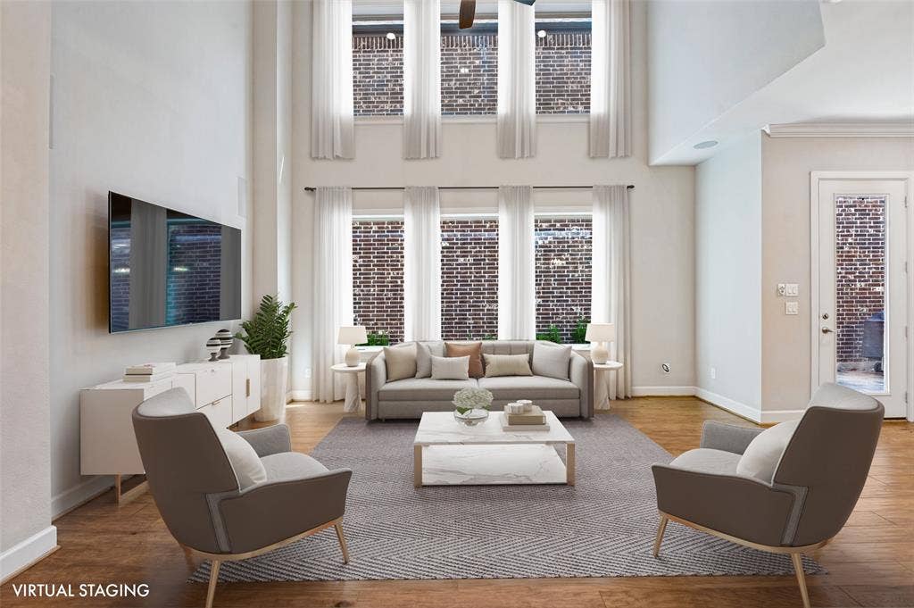 A dramatic wall of windows fills the main living space with natural light & brings the outdoors into view.