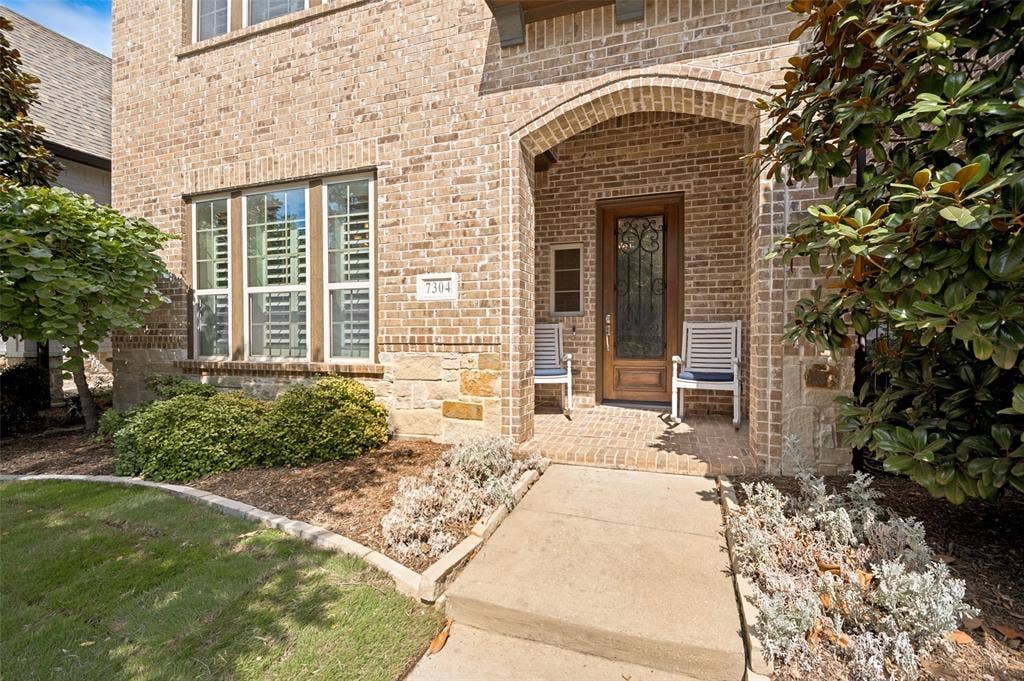 A charming covered front porch welcomes you home.