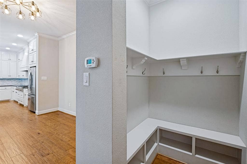 A mudroom just off the garage creates a convenient everyday drop zone with built-in storage & easy access to the heart of the home.