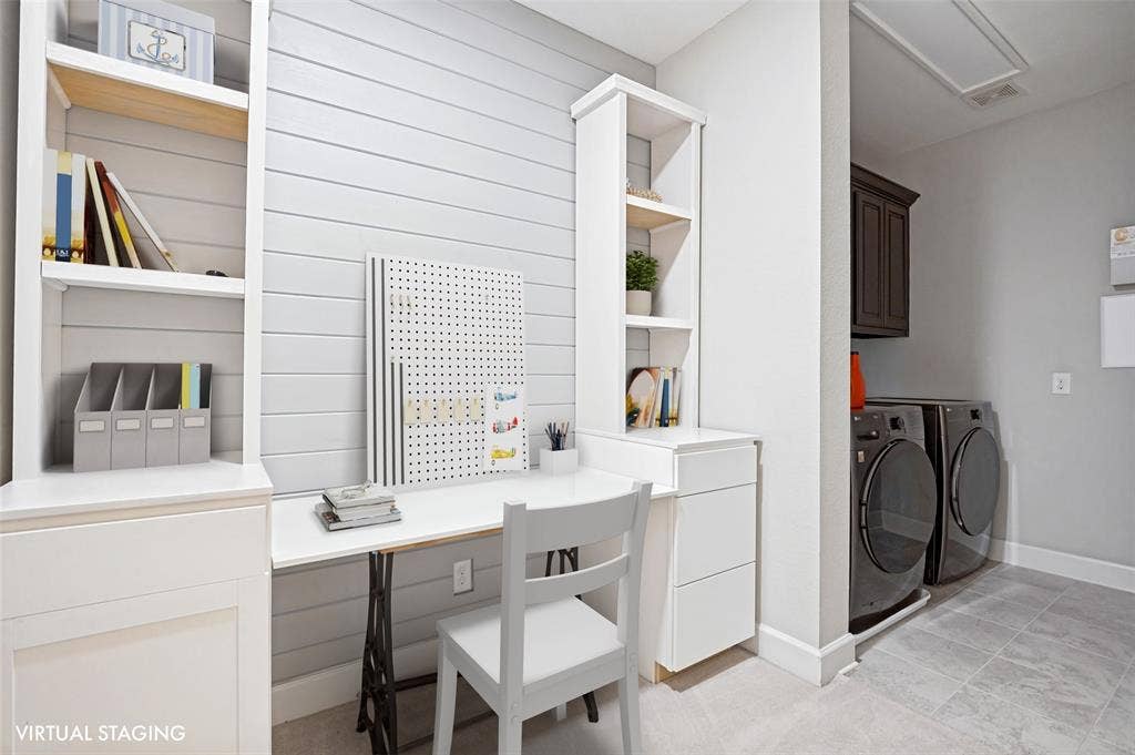 A rare everyday convenience, the laundry is tucked directly into the primary suite alongside a built-in desk & storage—perfect for keeping life organized.