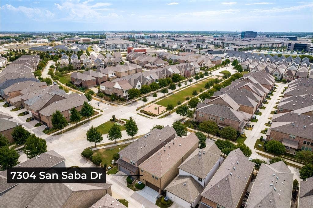 Aerial view showcases the home’s setting within sought-after Spicewood at Craig Ranch, surrounded by beautifully planned streets and green space.