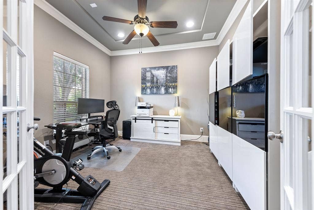 7011 Nueces Drive, Irving, TX 75039 Tray ceiling with a ceiling fan, recessed lighting, and crown molding