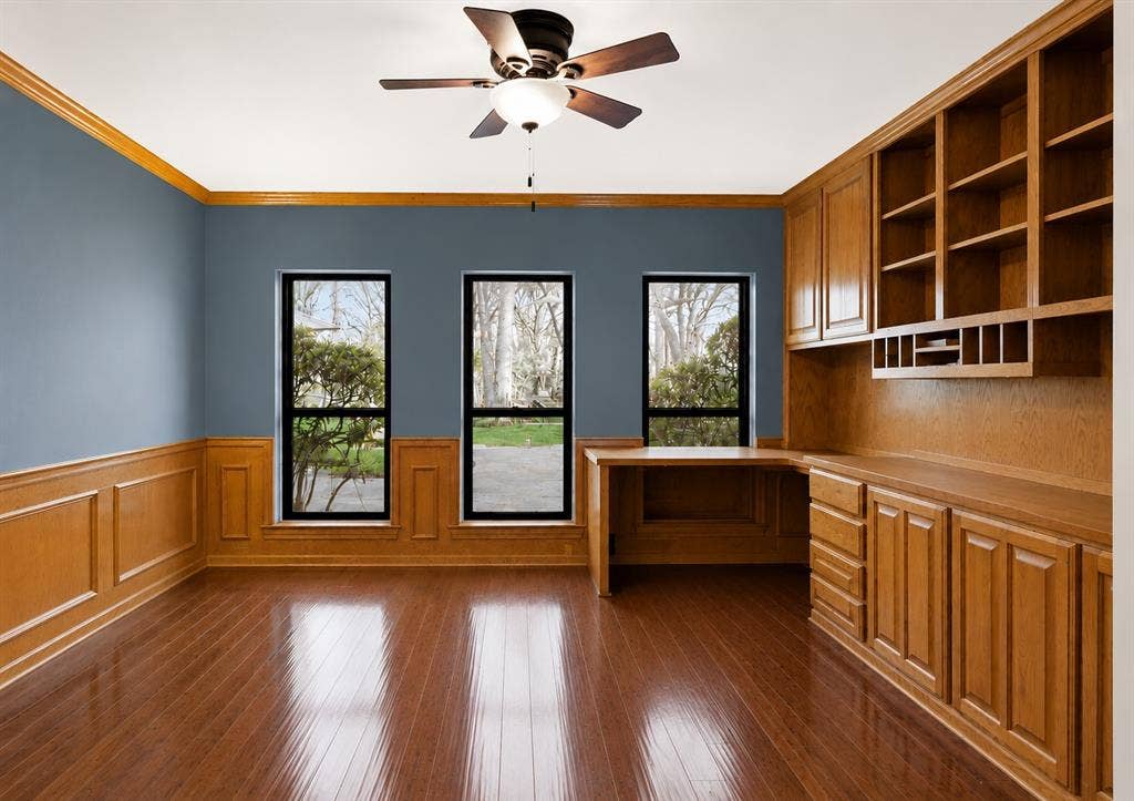 Home office with built in desk and storage