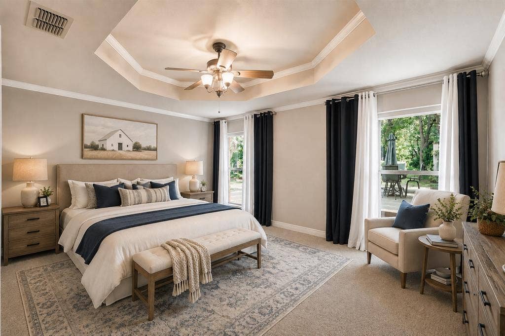 Primary bedroom with trey ceilings