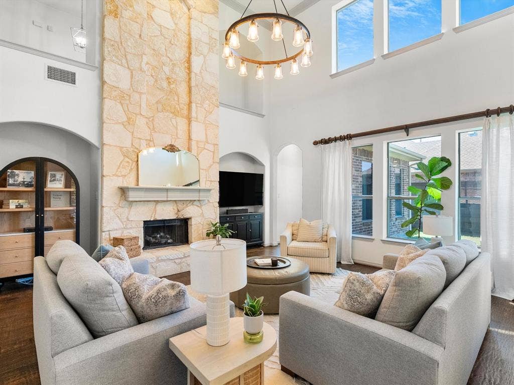 Impressive floor-to-ceiling stone fireplace complete with hearth and gas logs
