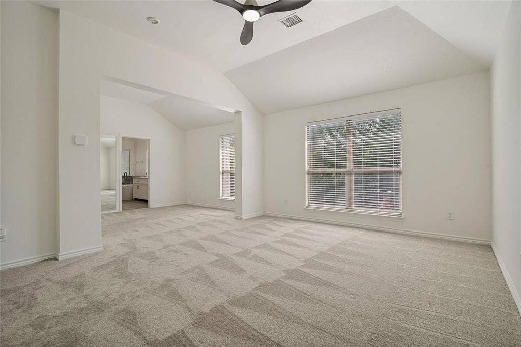 1516 Cedar Grove Court, Allen, TX 75002 Vaulted ceiling with a contemporary ceiling fan, recessed lighting, and a large window with horizontal blinds