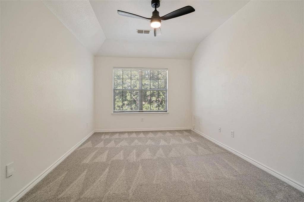 1516 Cedar Grove Court, Allen, TX 75002 Vaulted ceiling with a ceiling fan, carpet flooring, and a window with blinds