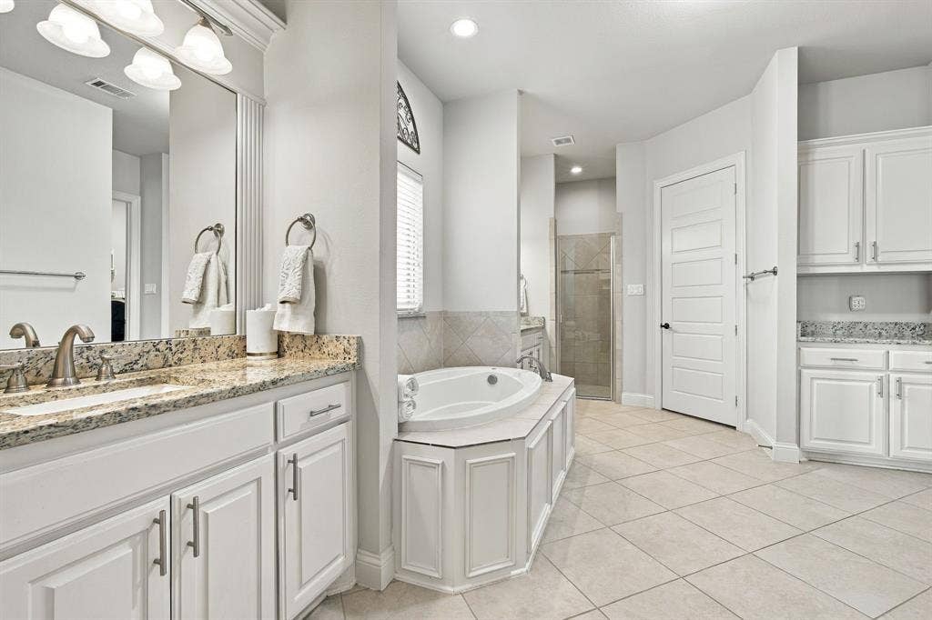 5620 Limestone Lane, Midlothian, TX 76065 Separate his and hers vanities and closets as well as a walk-in shower and separate bathtub