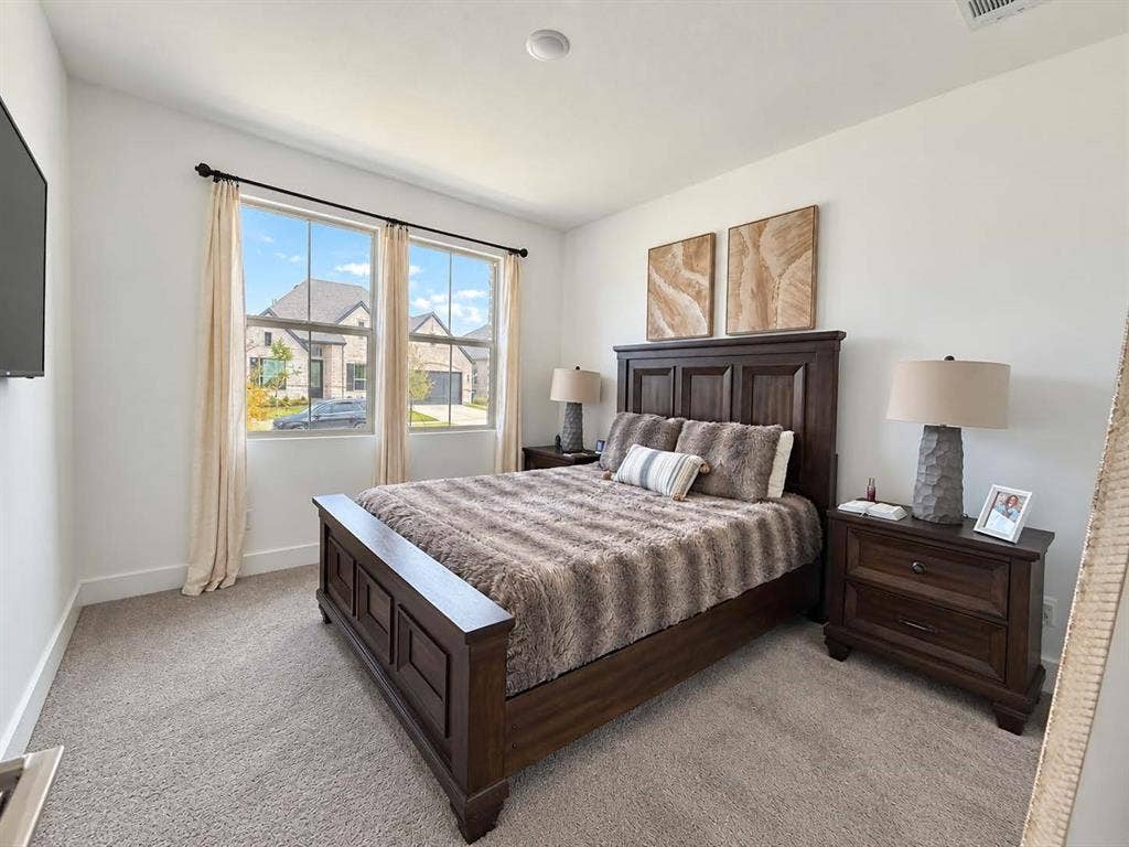 1411 Potenza Road, Fate, TX 75087 Carpeted flooring, white wall paint, dual windows with curtain rods, and recessed lighting