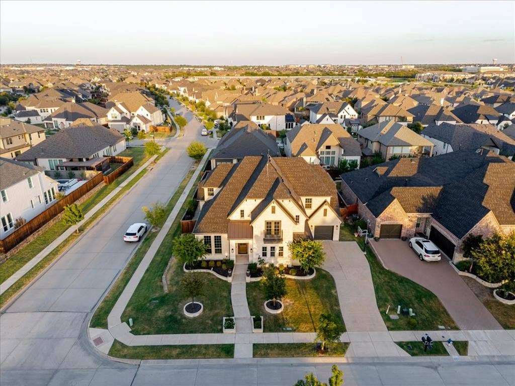 4102 Parkview Boulevard, Celina, TX 75009 Craftsman-style exterior with stone and siding accents, featuring a multi-car garage, established landscaping, and a corner lot