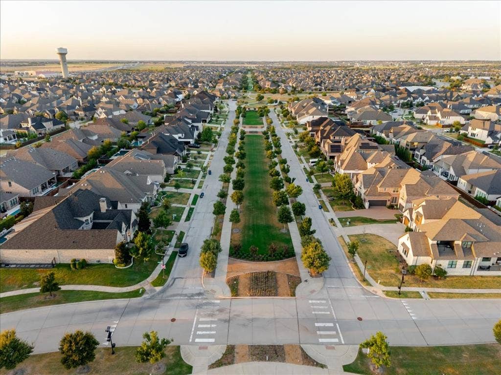 4102 Parkview Boulevard, Celina, TX 75009 Residential neighborhood with mature trees, manicured lawns, and a central green space