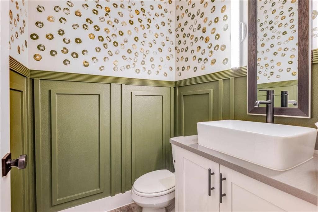 4102 Parkview Boulevard, Celina, TX 75009 Wainscoting with decorative paneling and a patterned accent wall