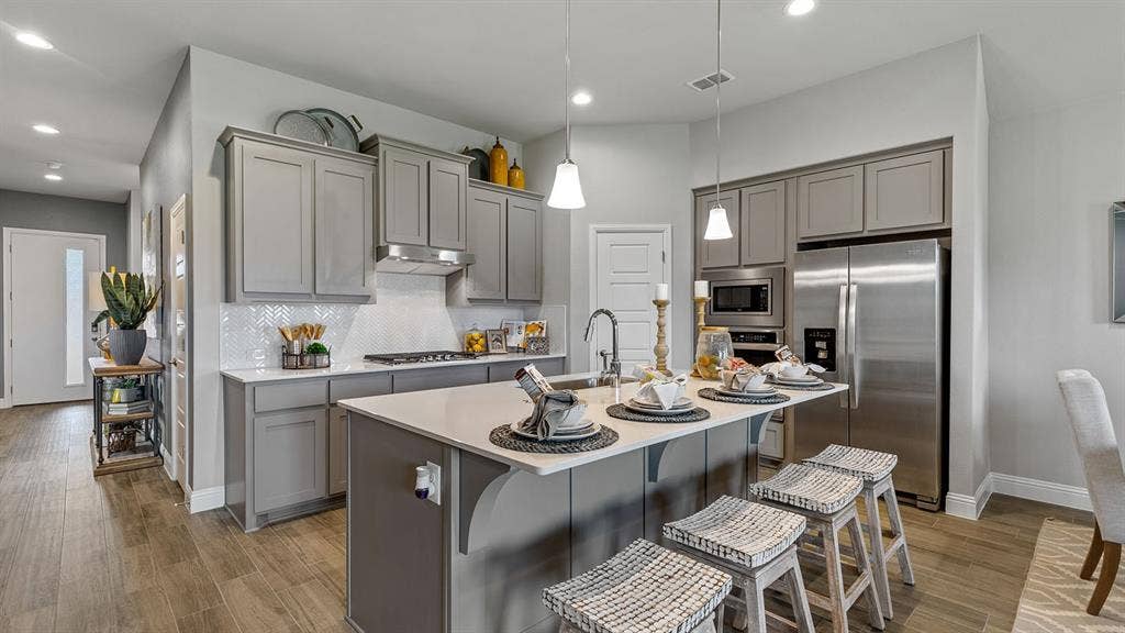 Kitchen - All Home and community information, including pricing, included features, terms, availability and amenities, are subject to change at any time without notice or obligation. All Drawings, pictures, photographs, video, square footages, floor plans, elevations, features, colors and sizes are approximate for illustration purposes only and will vary from the homes as built.