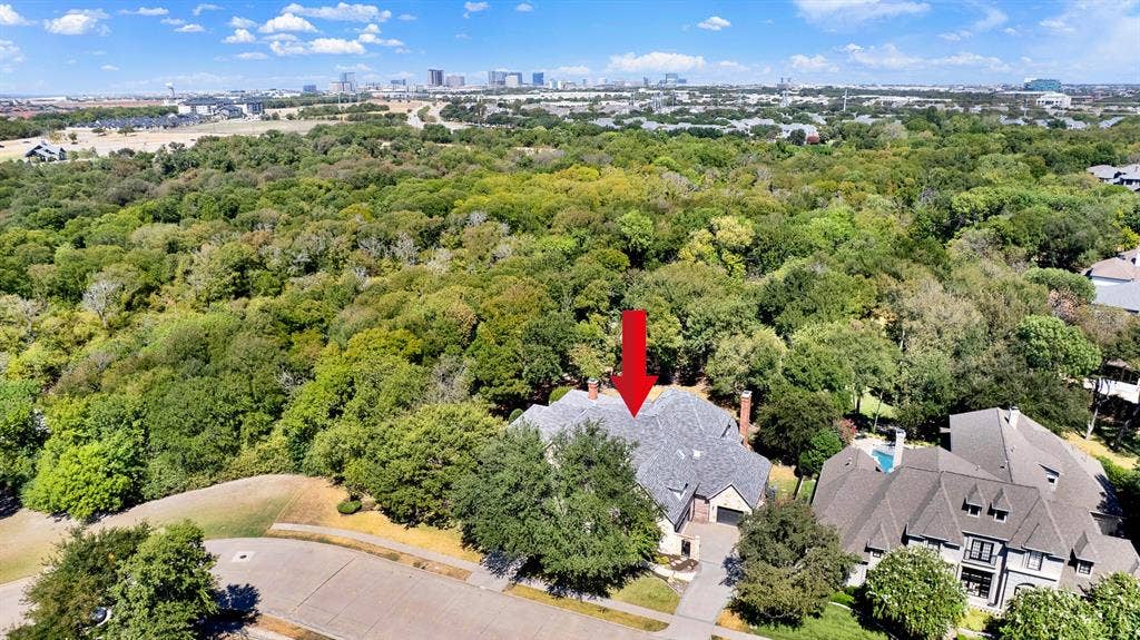 5237 SKY LAKE Drive, Plano, TX 75093 Positioned perfectly along a quiet treeline street, the home borders a massive green canopy stretching toward the horizon. Enjoy peaceful evening sunsets from your front lawn while taking in the endless natural views.