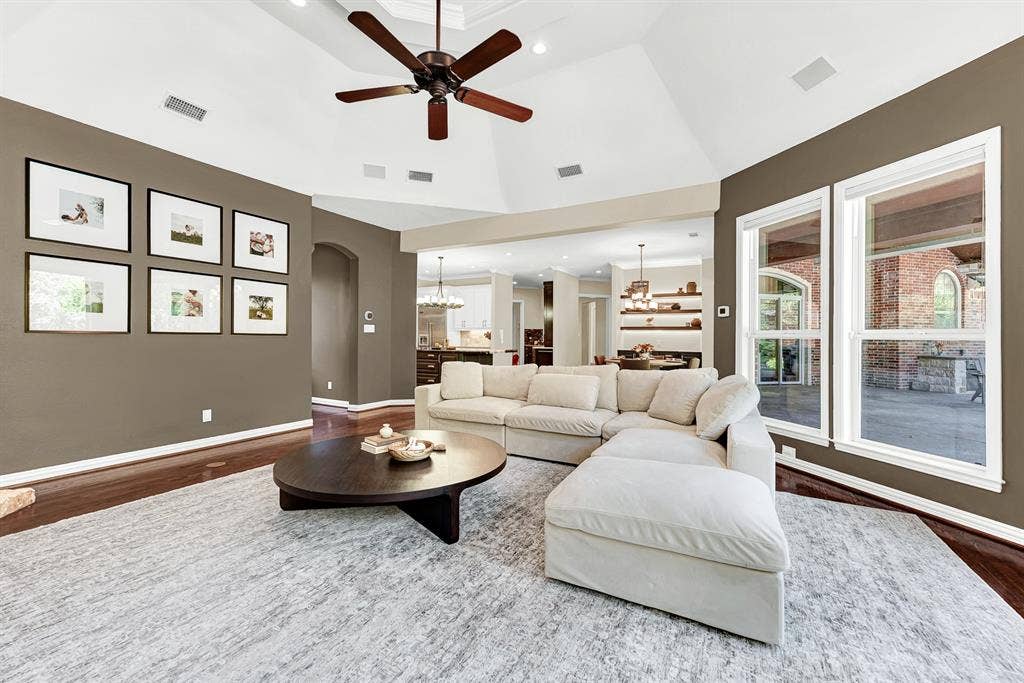 5237 SKY LAKE Drive, Plano, TX 75093 An open, arch-framed entry connects the living volume effortlessly back toward the kitchen and dining spaces. Feel the easy rhythm of daily life as family members drift smoothly between rooms after school