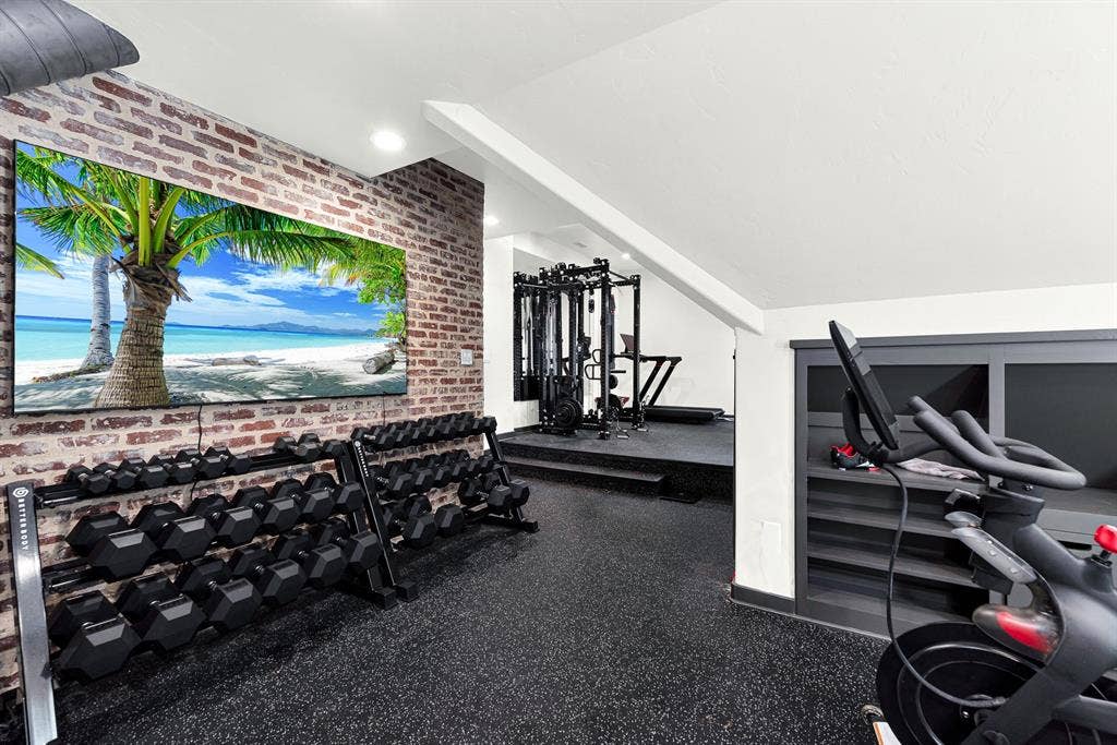 5237 SKY LAKE Drive, Plano, TX 75093 Exposed brick accenting brings industrial character to the space, beautifully juxtaposed against clean white ceiling angles. Picture powering through an afternoon training session, completely energized within your private home sanctuary.