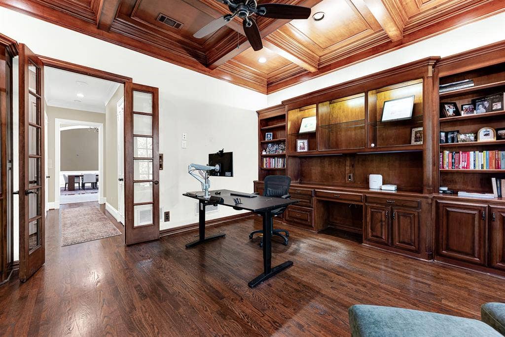 5237 SKY LAKE Drive, Plano, TX 75093 Warm illuminated built-ins and glass French doors create a cozy, defined study sanctuary. Settle into an inspiring afternoon, completely focused in your quiet private retreat