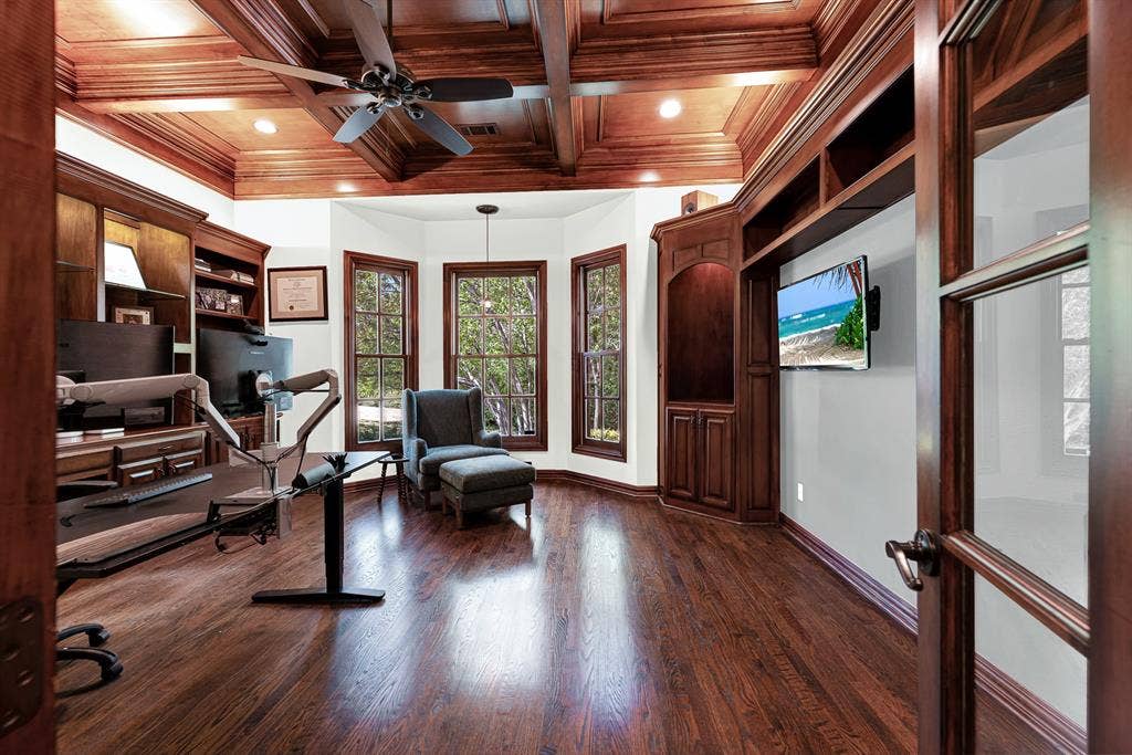 5237 SKY LAKE Drive, Plano, TX 75093 A rich coffered wood ceiling caps a sunlit bay window alcove framing tranquil treetop vistas. Spend a quiet morning reflecting in natural light before starting your day
