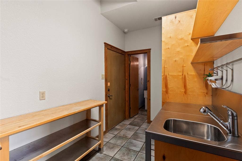 5459 Woodland Shores Drive, Log Cabin, TX 75148 Spacious laundry room with sink with access door from exterior of the home, garage, and just off the kitchen.