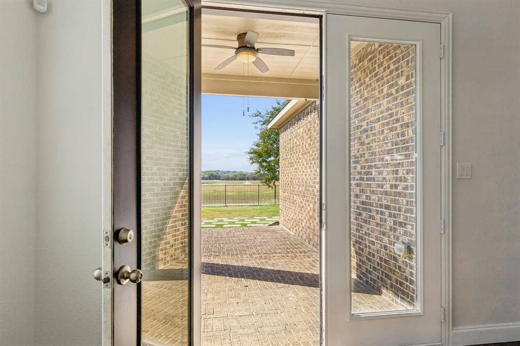 Patio access through glass-paneled double doors