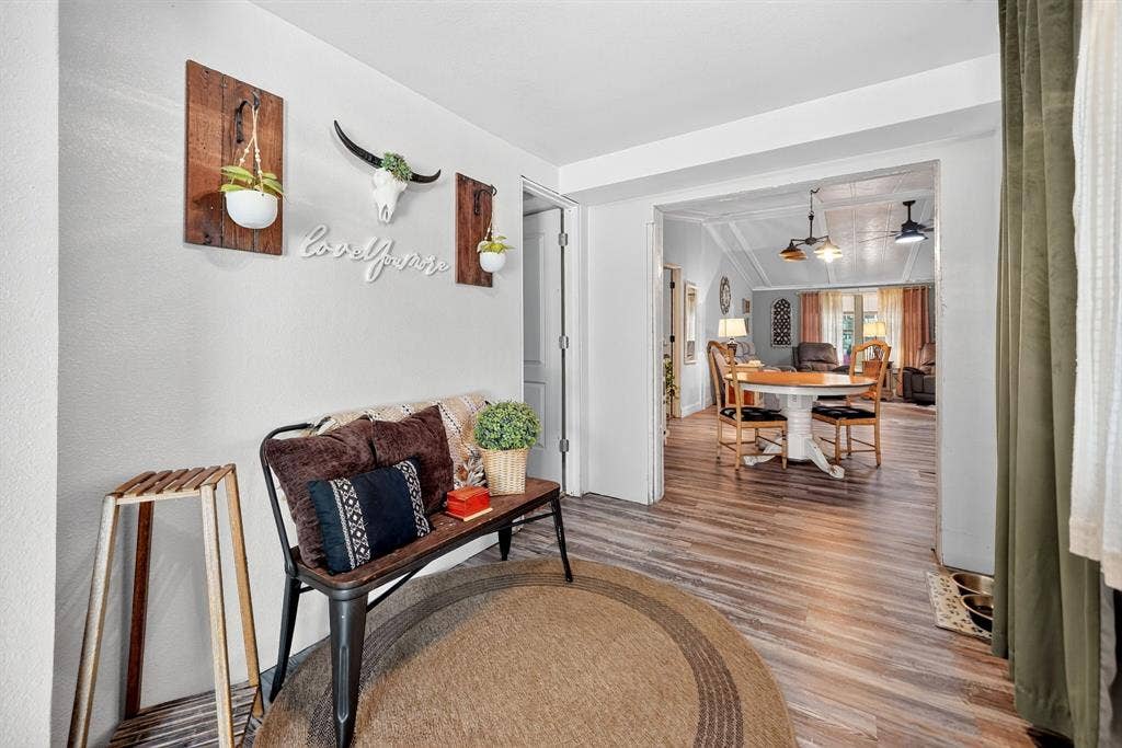 302 Longleaf Street, Gun Barrel City, TX 75156 Entryway featuring wood-finish flooring and a broad doorway