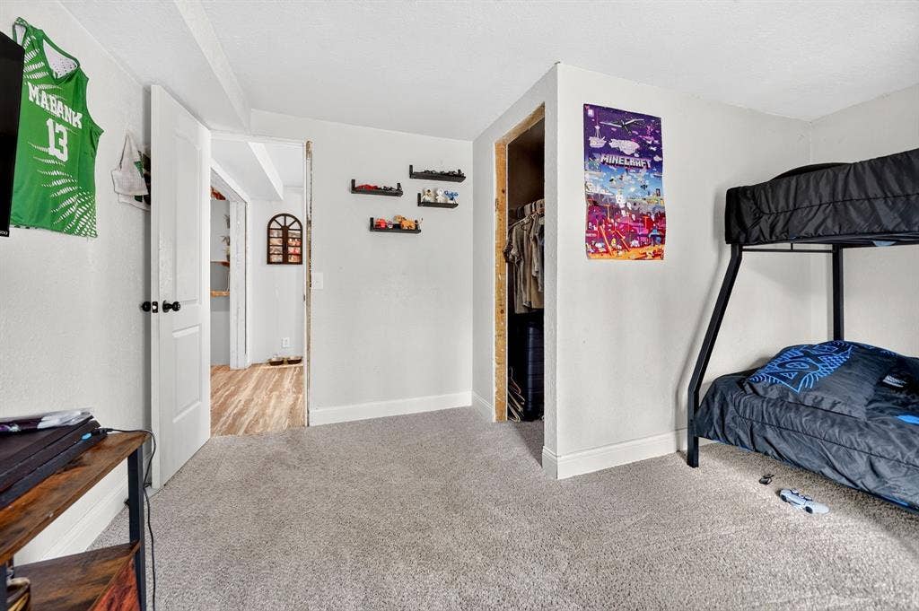 302 Longleaf Street, Gun Barrel City, TX 75156 Light-toned carpet flooring and white walls
