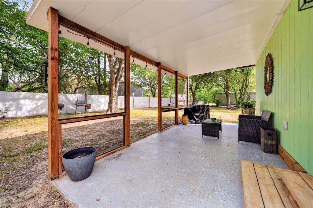 302 Longleaf Street, Gun Barrel City, TX 75156 Covered patio with a concrete surface, wood-framed screen enclosure, and direct access to the backyard