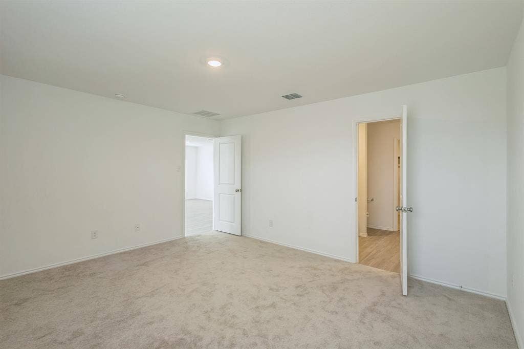 7904 Thornton Drive, McKinney, TX 75071 Neutral-toned carpeting, white walls, and recessed lighting