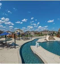 7904 Thornton Drive, McKinney, TX 75071 Resort-style pool area featuring a lazy river, water slide, and shaded lounge spaces