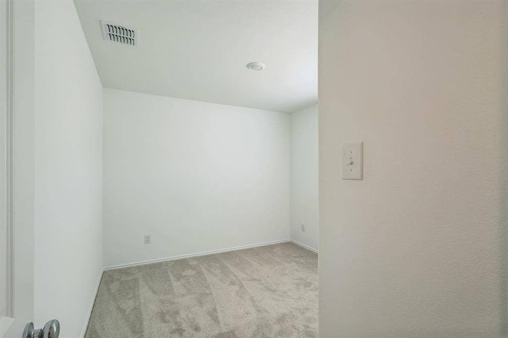 7904 Thornton Drive, McKinney, TX 75071 Neutral wall colors, recessed ceiling lighting, and carpet flooring