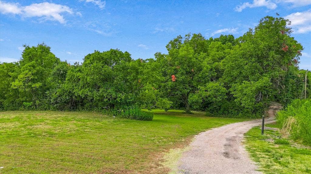 548 Dalrock Road, Rowlett, TX 75089 This road take you all the way to the back of the lot.