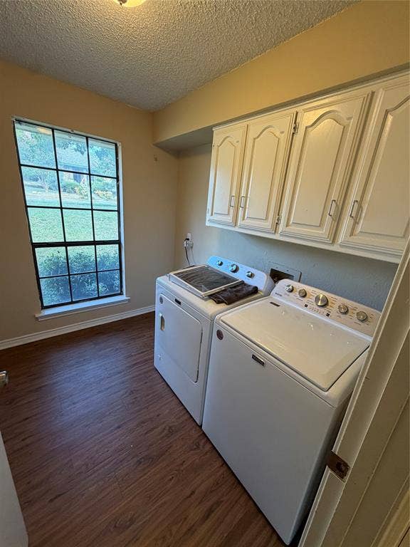 3912 Bandera Drive, Plano, TX 75074 Wood-finish flooring, overhead cabinetry, and a window with exterior views
