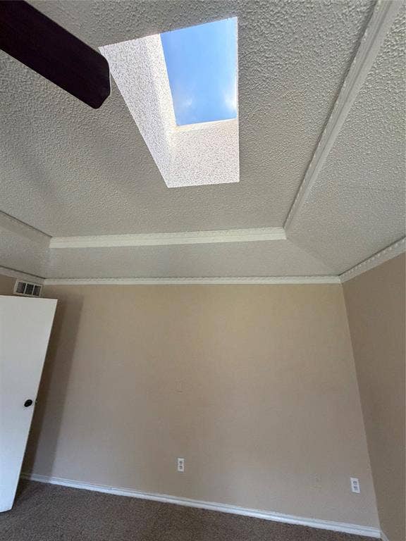 3912 Bandera Drive, Plano, TX 75074 Recessed skylight, tray ceiling, ceiling fan, neutral wall paint, and white trim