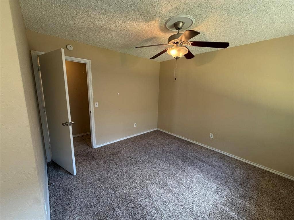 3912 Bandera Drive, Plano, TX 75074 Carpeted flooring, neutral wall paint, and a ceiling fan with integrated lighting