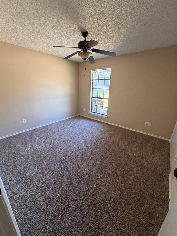 3912 Bandera Drive, Plano, TX 75074 Carpeted room featuring neutral-toned walls, a single window with a white frame, and a ceiling-mounted fan with integrated lighting