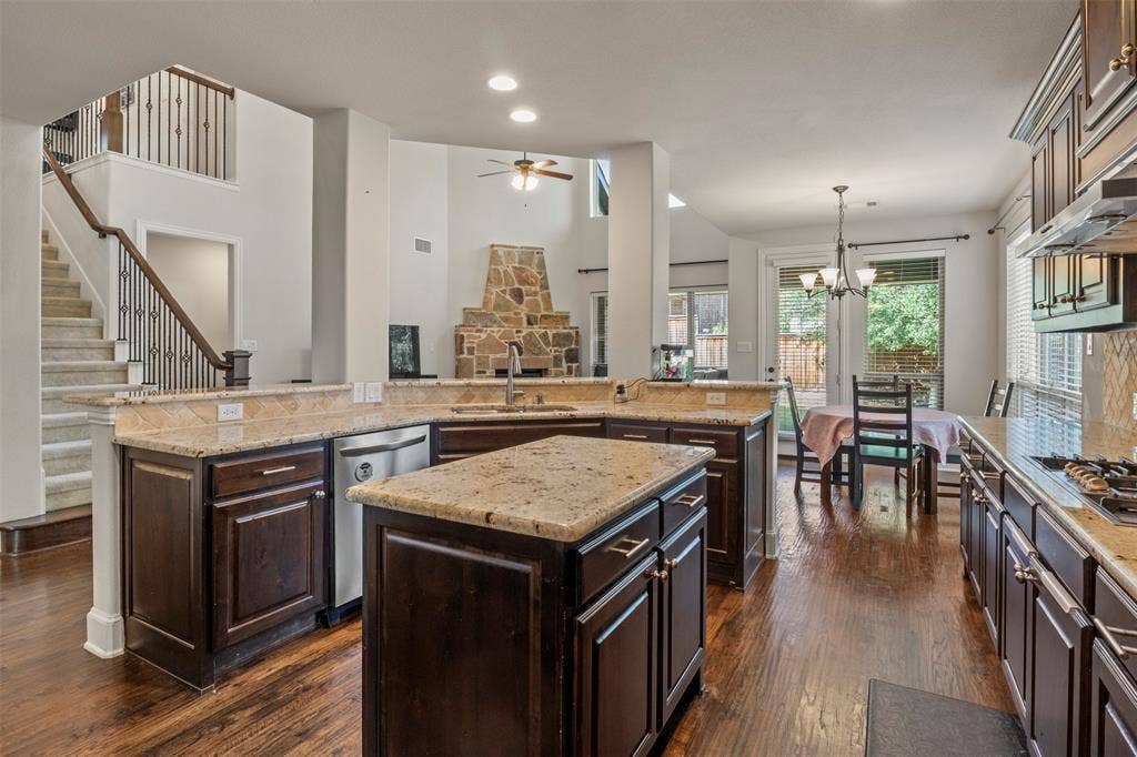Gourmet kitchen includes granite countertops, SS appliances, gas cooktop, 2024 LG dishwasher